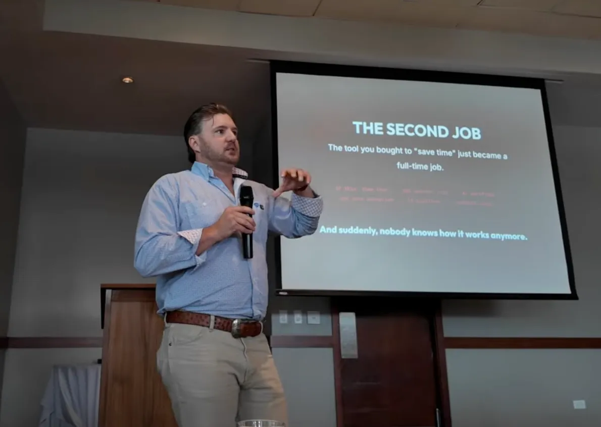 Matthew Henry leading the Big I Illinois hands-on AI workshop, in front of a slide titled The Second Job